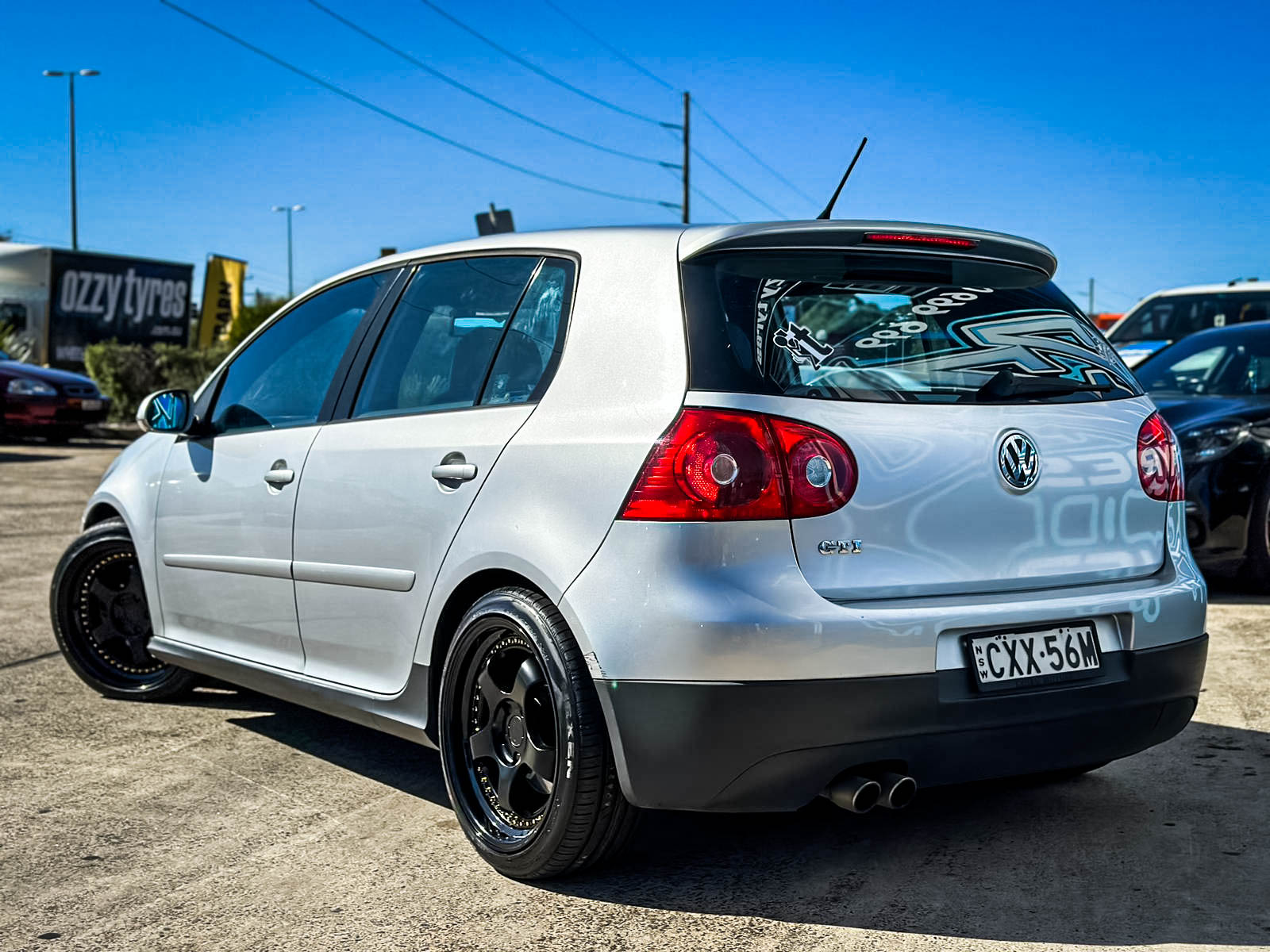 VOLKSWAGEN_GOLF_GTI_HUSSLA_ZEN_MATTE_BLACK_GOLD_RIVETS_GLOSS_BLACK_LIP_3.jpg
