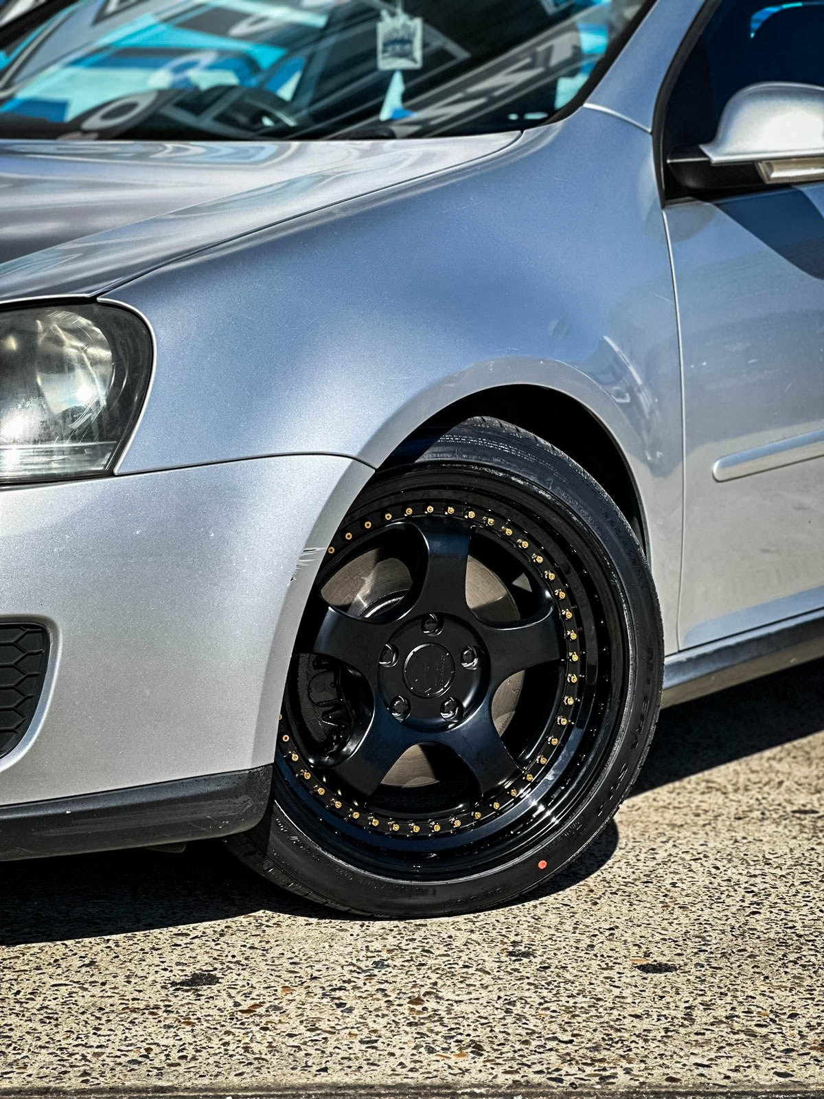 VOLKSWAGEN_GOLF_GTI_HUSSLA_ZEN_MATTE_BLACK_GOLD_RIVETS_GLOSS_BLACK_LIP_5.jpg