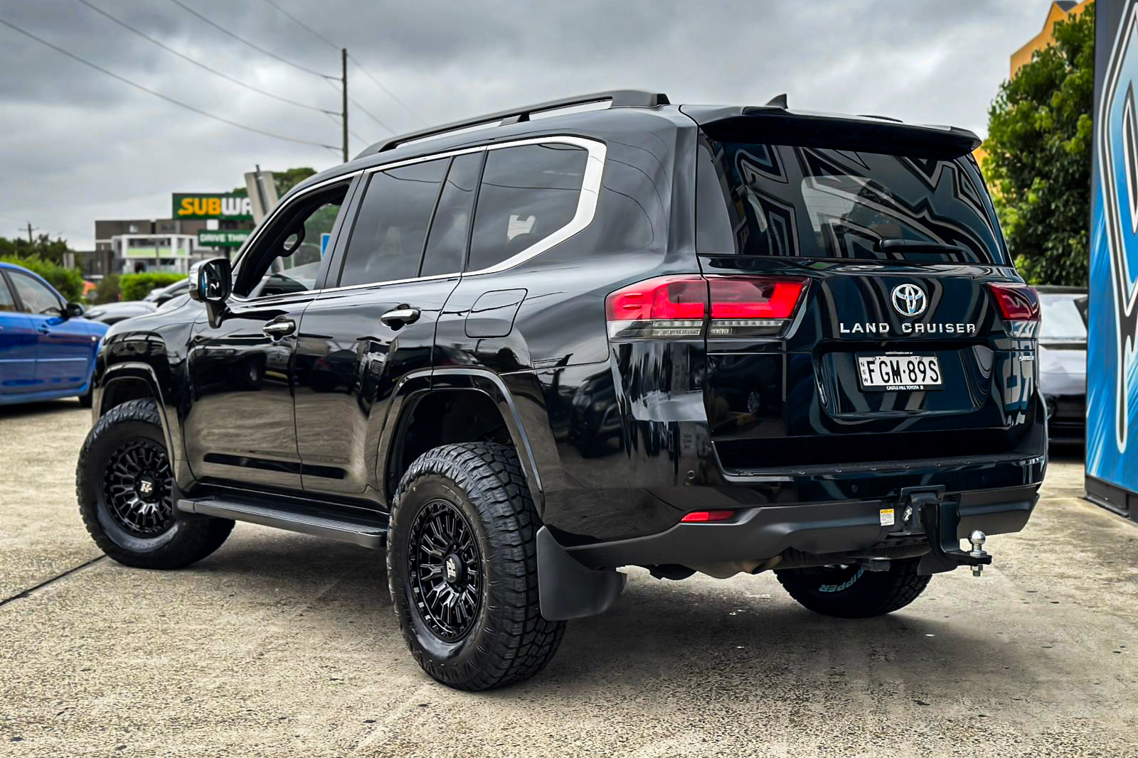 TOYOTA_LAND_CRUISER_HUSSLA_SNYPER_GLOSS_BLACK_DARK_TINT_FACE_1_2_3.jpg