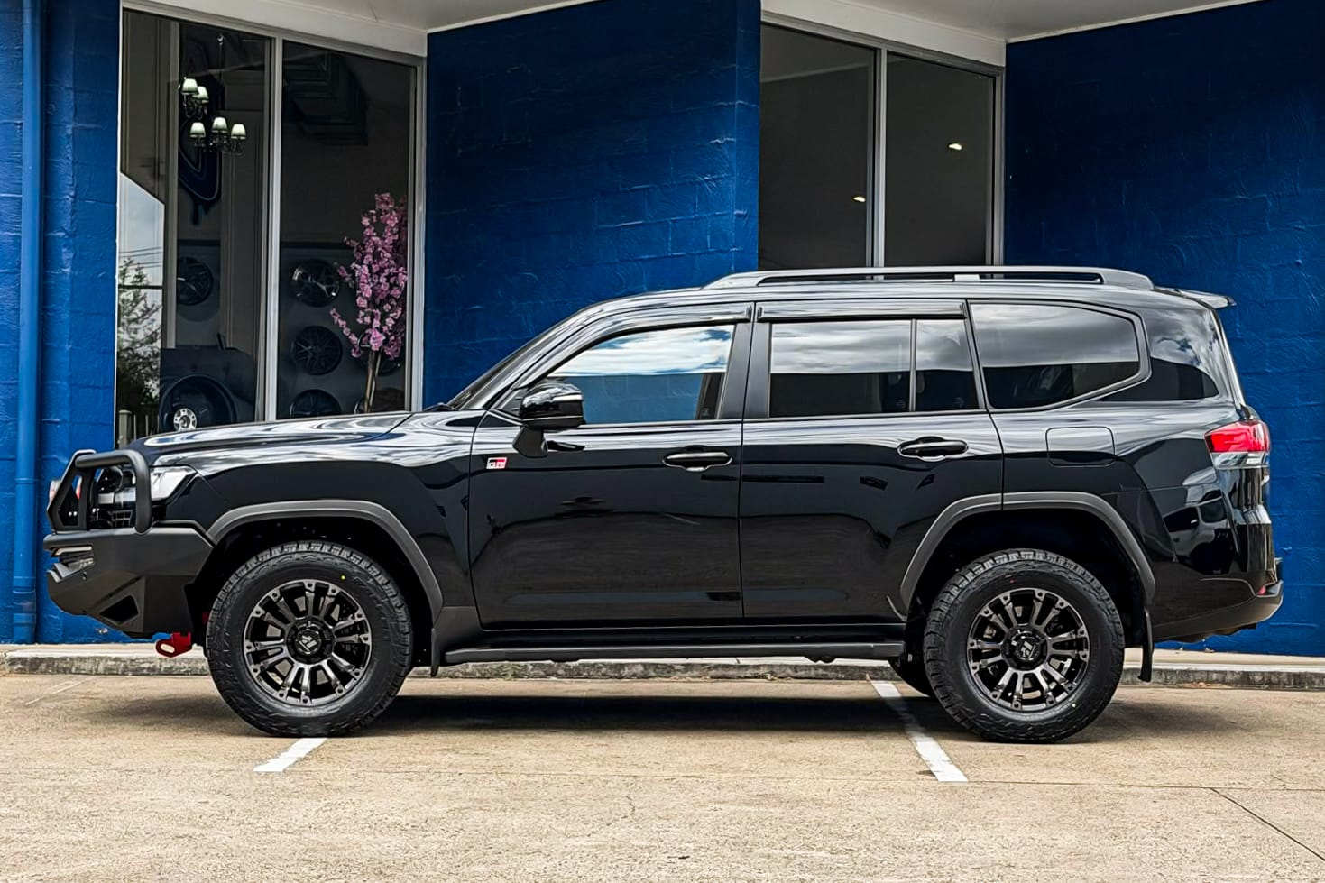 TOYOTA_LAND_CRUISER_HUSSLA_AMBUSH_GLOSS_BLACK_DARK_TINT_FACE_1_2_3.jpg