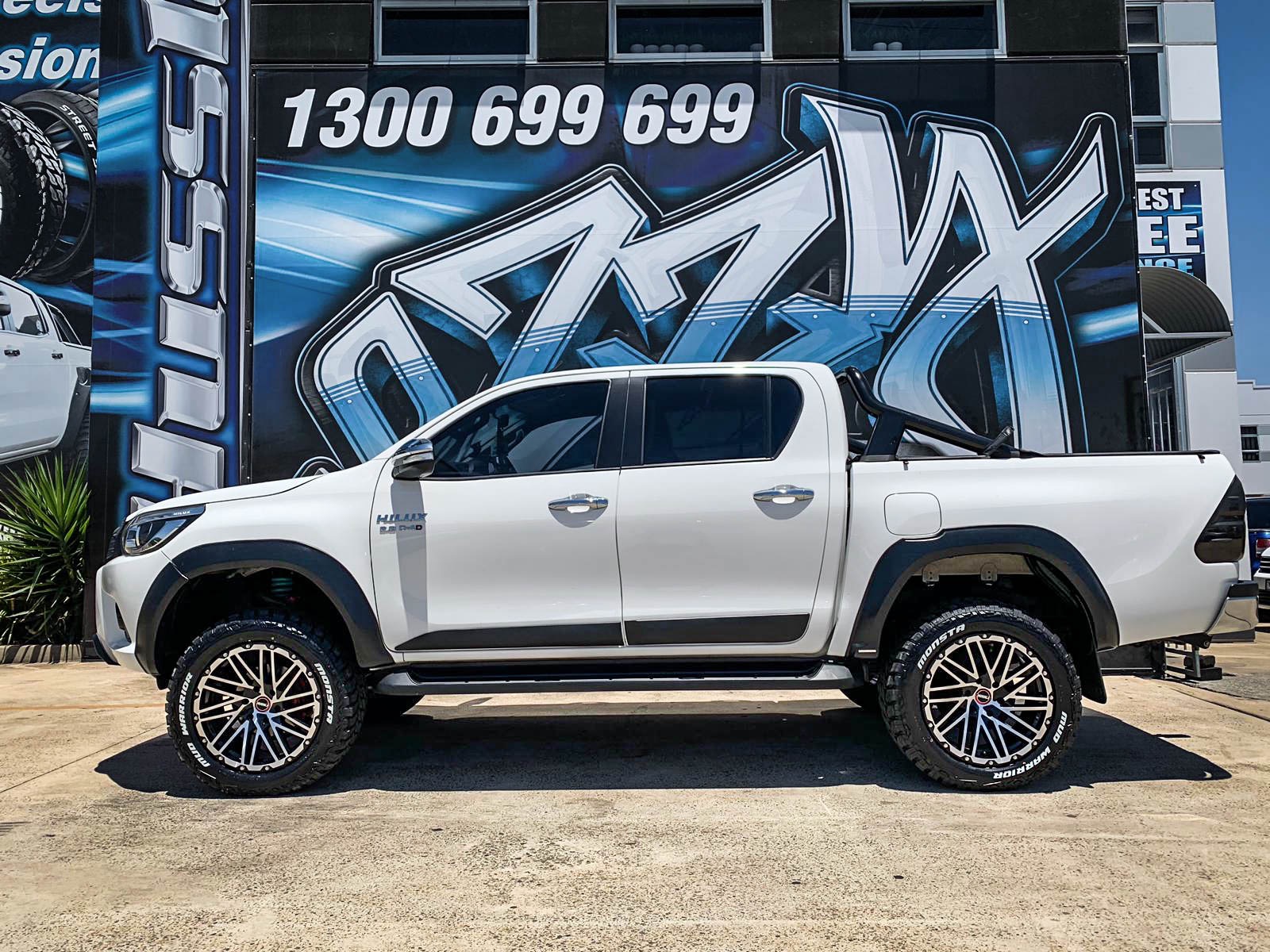 TOYOTA_HILUX_HUSSLA_SS1_GLOSS_BLACK_MACHINED_FACE_CHROME_BOLTS_20_MONSTA_MUD_WARRIOR4.jpg