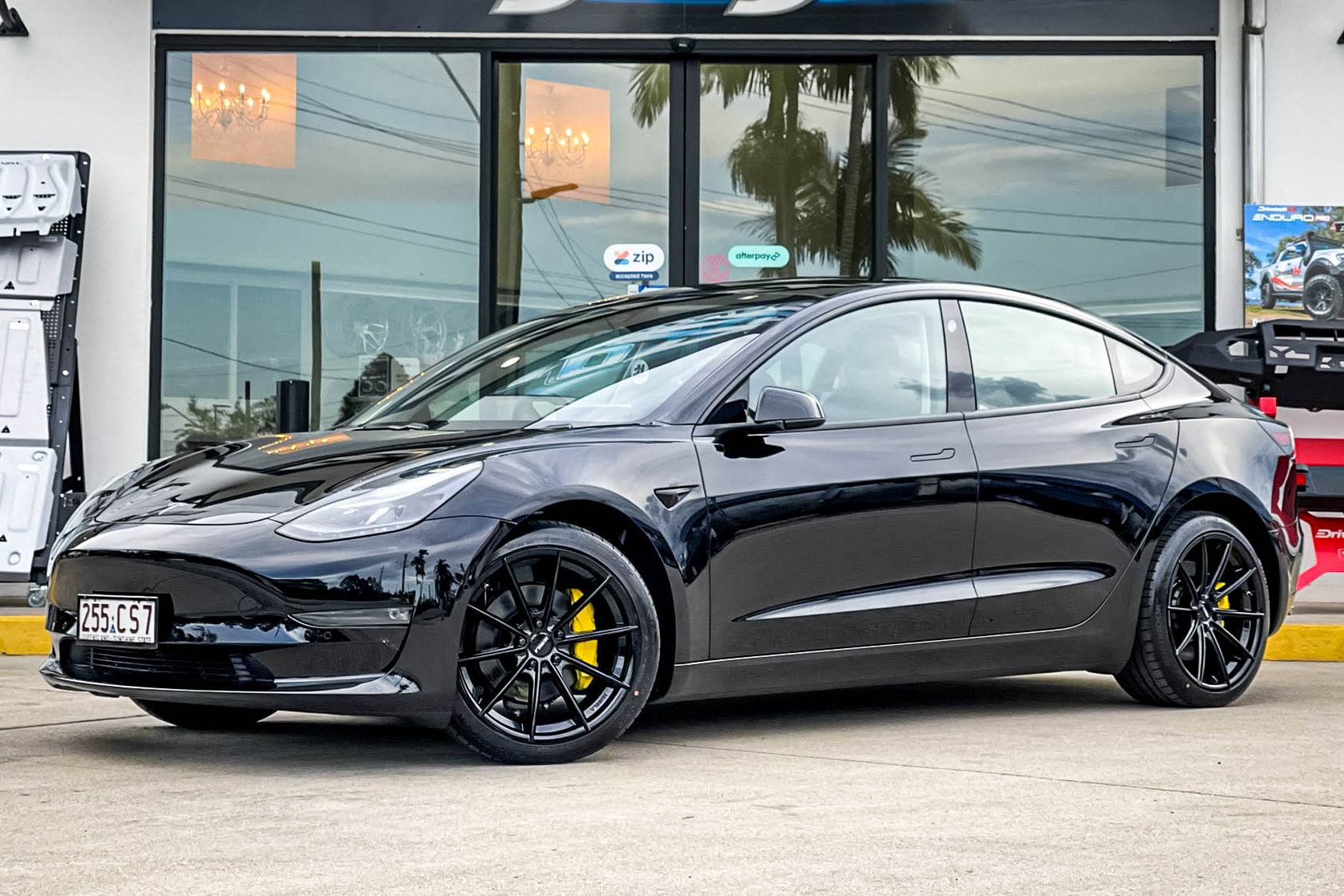 Tesla model 3 with store black rims